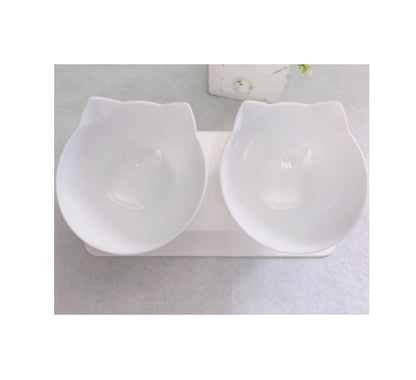 White ceramic cat-shaped double bowl on a light gray surface