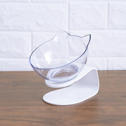 Clear glass bowl with white base on a wooden surface